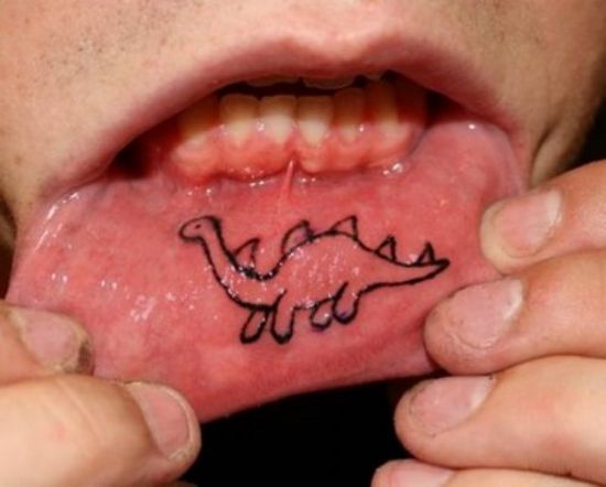Stegosaurus lip tattoo