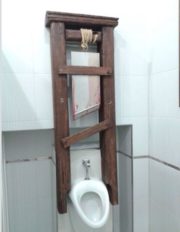 Guillotine execution in men’s room